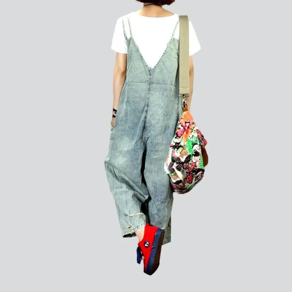 Distressed women's jean dungaree